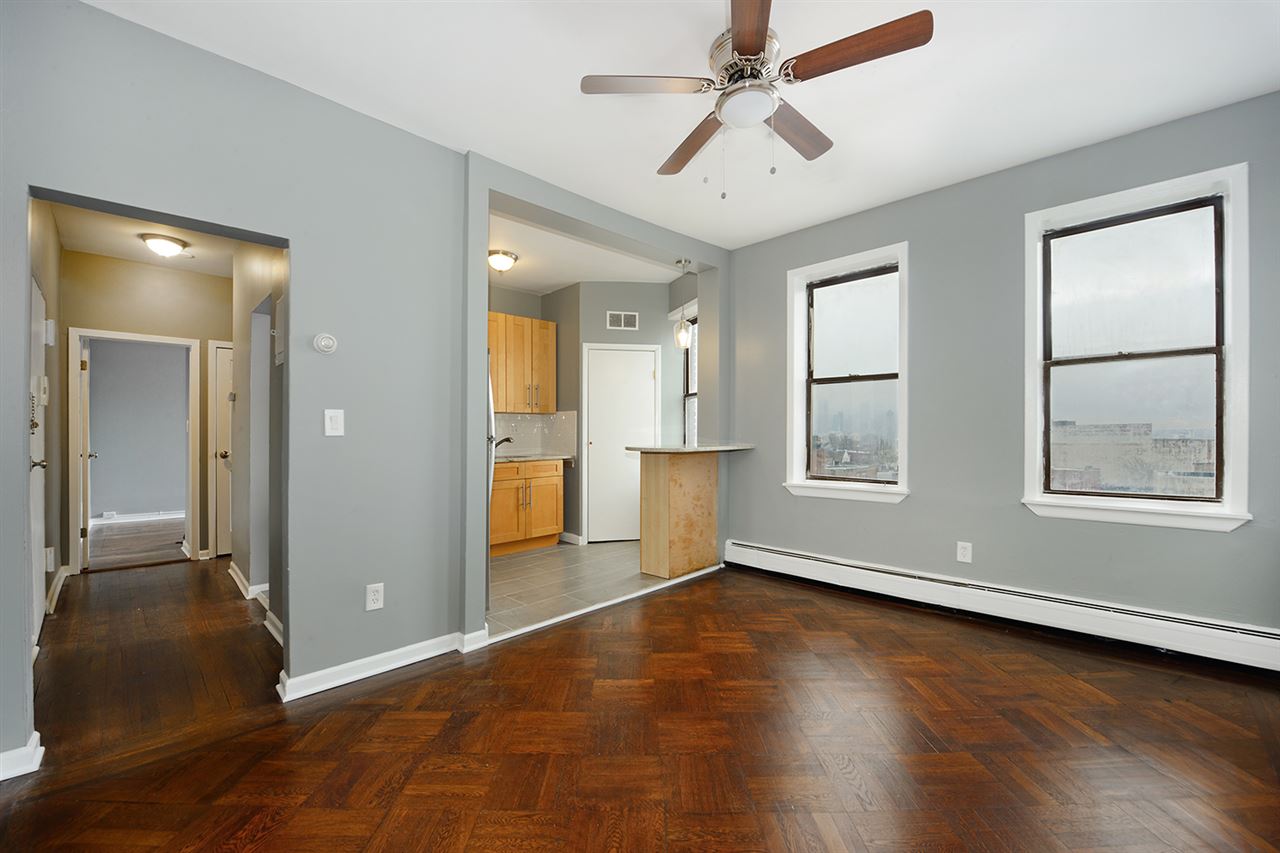 a view of livingroom with hardwood floor and a ceiling fan
