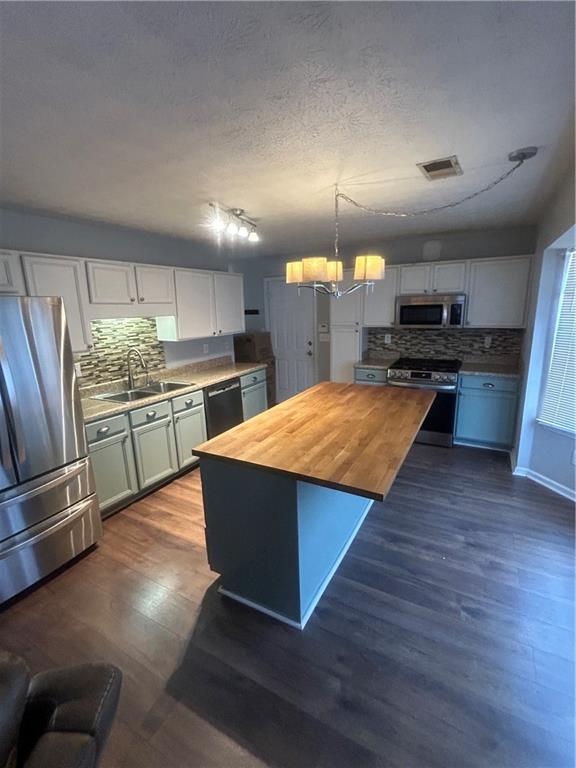 2549 Rainbow Creek Drive Decatur, GA 30034 - Photo 25 of 57 a kitchen with stainless steel appliances granite countertop a stove and a refrigerator