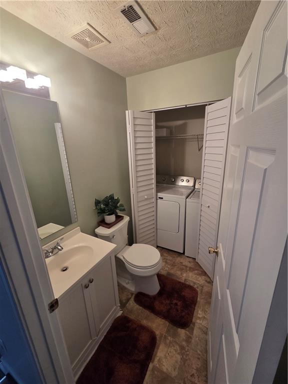 2549 Rainbow Creek Drive Decatur, GA 30034 - Photo 34 of 57 a bathroom with a toilet a sink and a mirror