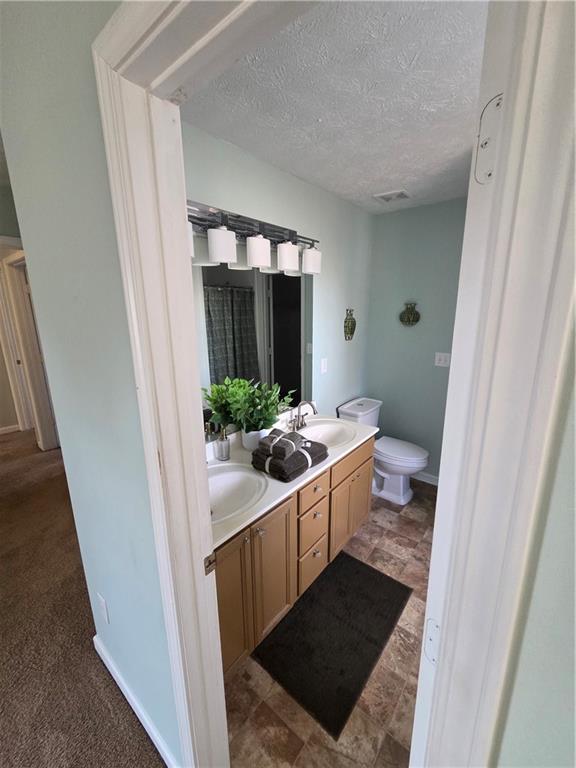 2549 Rainbow Creek Drive Decatur, GA 30034 - Photo 36 of 57 a bathroom with a sink and a mirror