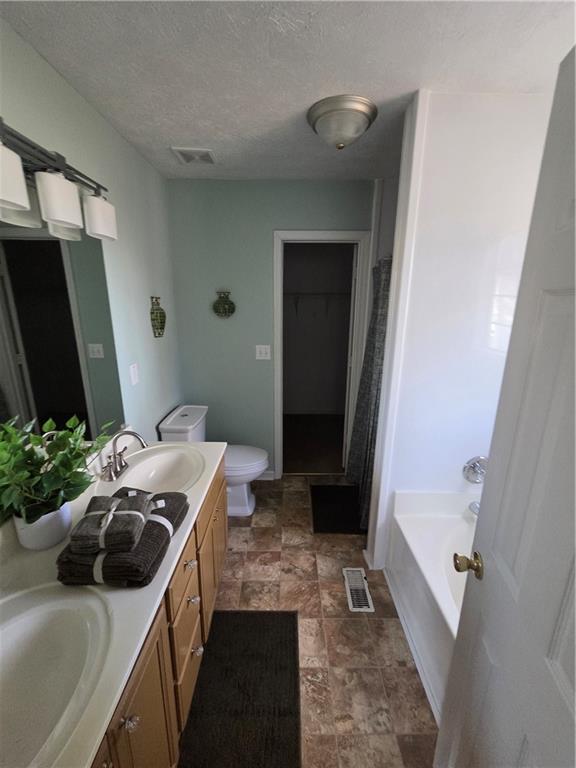 2549 Rainbow Creek Drive Decatur, GA 30034 - Photo 39 of 57 a bedroom with a bed and a flat tv screen