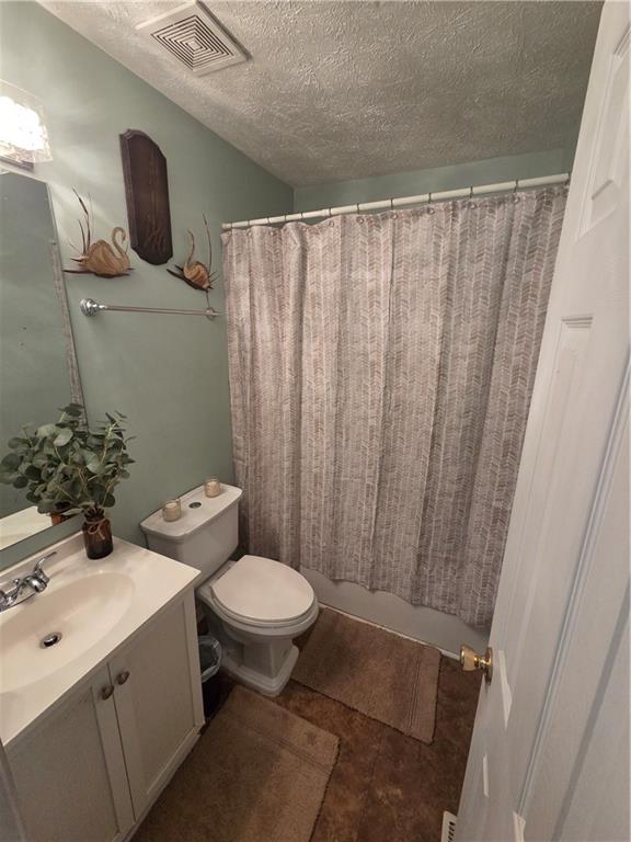 2549 Rainbow Creek Drive Decatur, GA 30034 - Photo 40 of 57 a bathroom with a sink toilet and shower