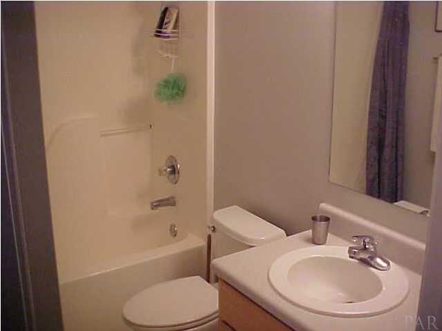 7155 Jennifer Road Pensacola, FL 32526 - Photo 12 of 14 SECOND BATH IS ROOMY AND SITS BETWEEN THE TWO LARGE ADDITIONAL BEDROOMS..