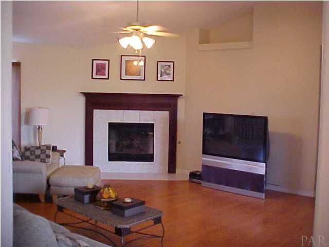 7155 Jennifer Road Pensacola, FL 32526 - Photo 3 of 14 COZY GREAT ROOM, FIREPLACE WITH GAS LOGS AND NICE WOOD FLOORING...