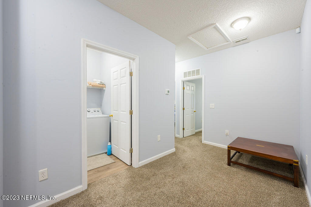 8683 Ribbon Falls Lane Jacksonville, FL 32244 - Photo 18 of 43 a view of a room with closet