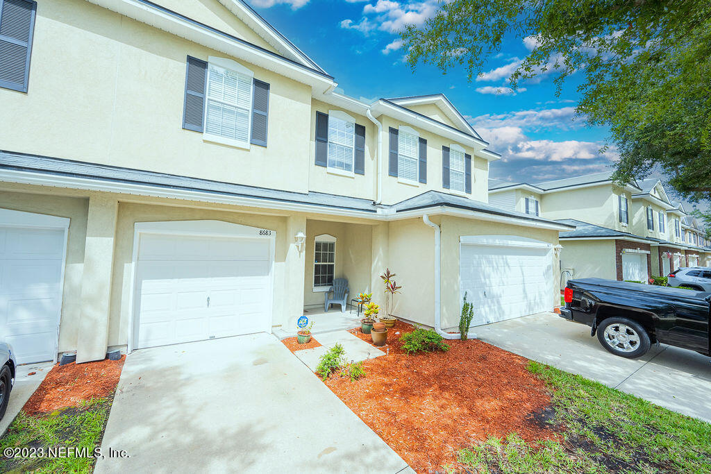 8683 Ribbon Falls Lane Jacksonville, FL 32244 - Photo 21 of 43 a front view of a house with parking area