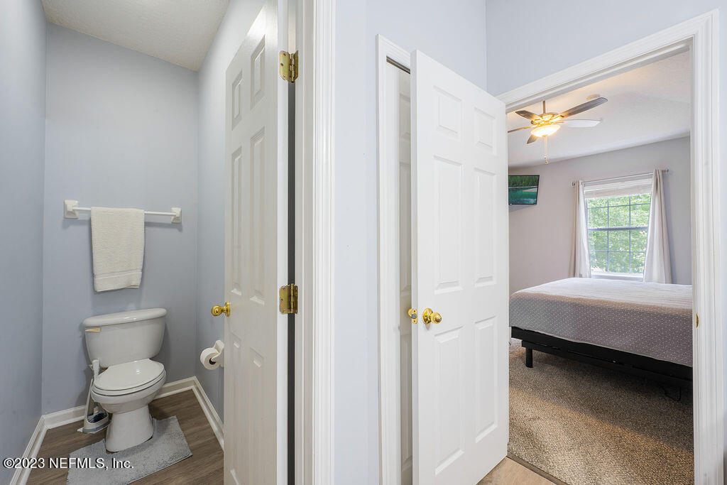 8683 Ribbon Falls Lane Jacksonville, FL 32244 - Photo 31 of 43 a bathroom with a toilet sink and shower