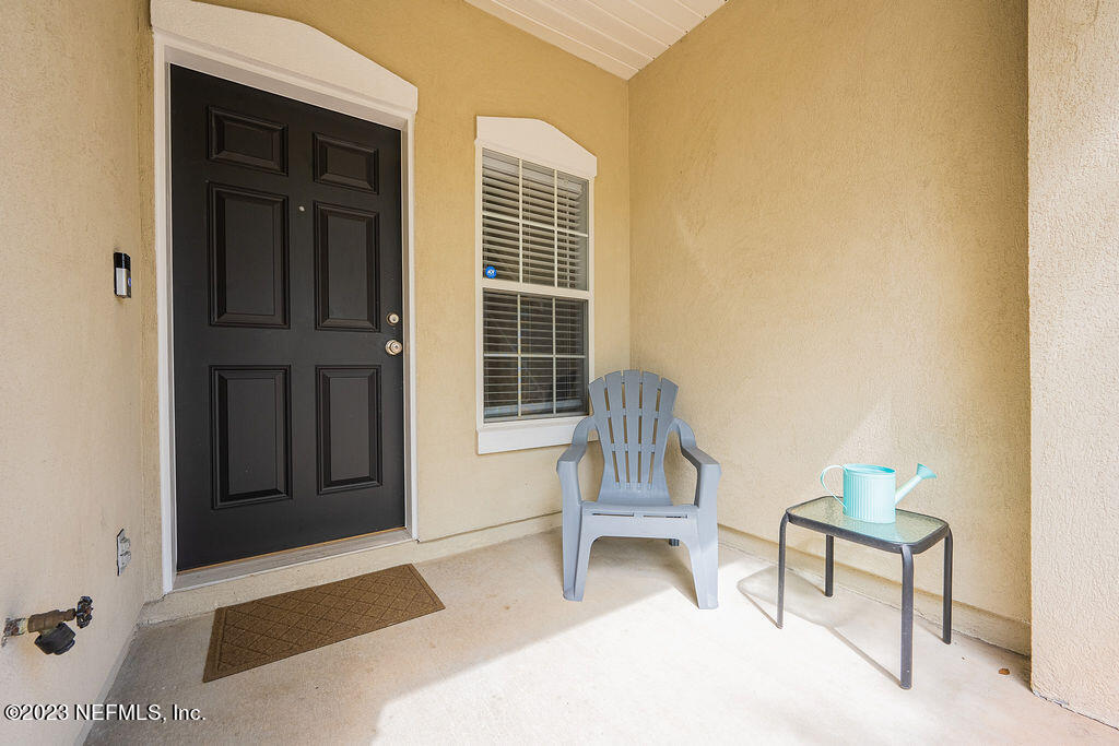 8683 Ribbon Falls Lane Jacksonville, FL 32244 - Photo 33 of 43 a bedroom with a bed and a chair