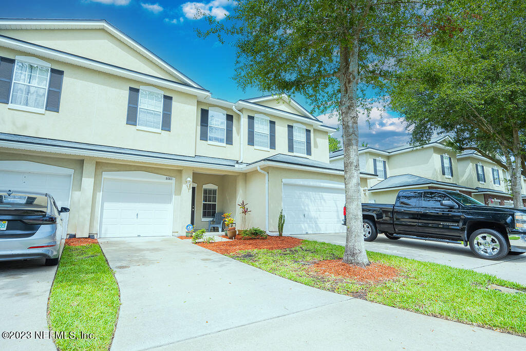 8683 Ribbon Falls Lane Jacksonville, FL 32244 - Photo 34 of 43 a house view with a garden space