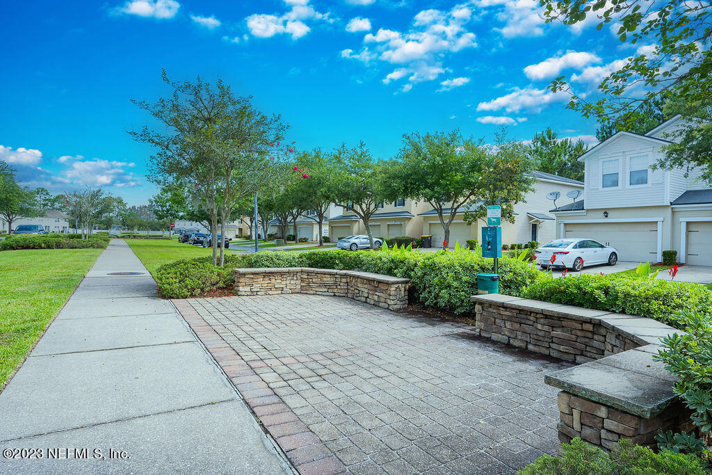 8683 Ribbon Falls Lane Jacksonville, FL 32244 - Photo 35 of 43 a view of backyard with plants and outdoor seating