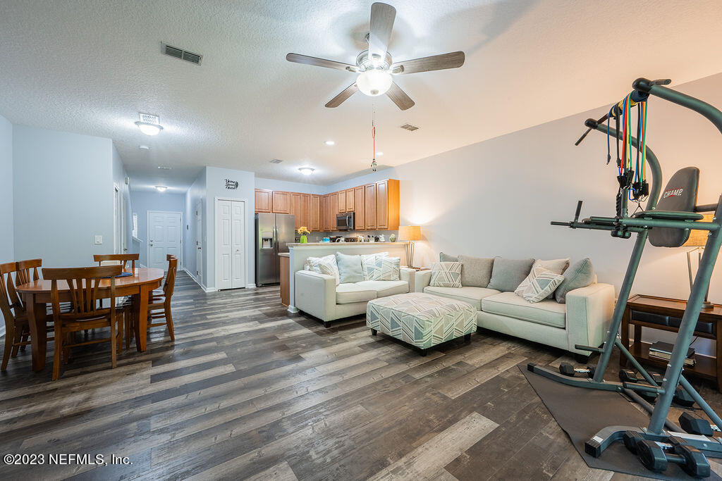 8683 Ribbon Falls Lane Jacksonville, FL 32244 - Photo 39 of 43 a living room with furniture and kitchen view