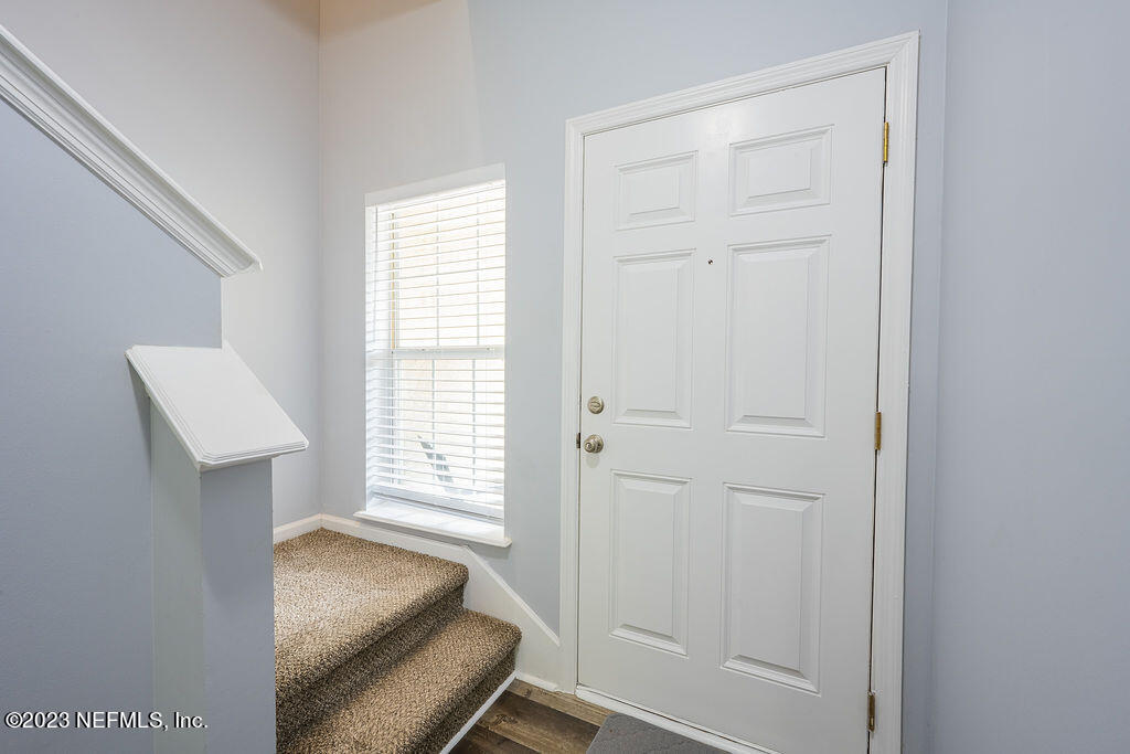 8683 Ribbon Falls Lane Jacksonville, FL 32244 - Photo 41 of 43 a room with a chair and a window