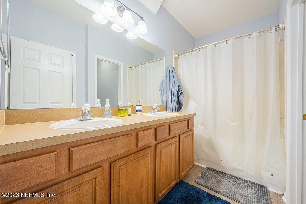8683 Ribbon Falls Lane Jacksonville, FL 32244 - Photo 8 of 43 a bathroom with a sink and a mirror