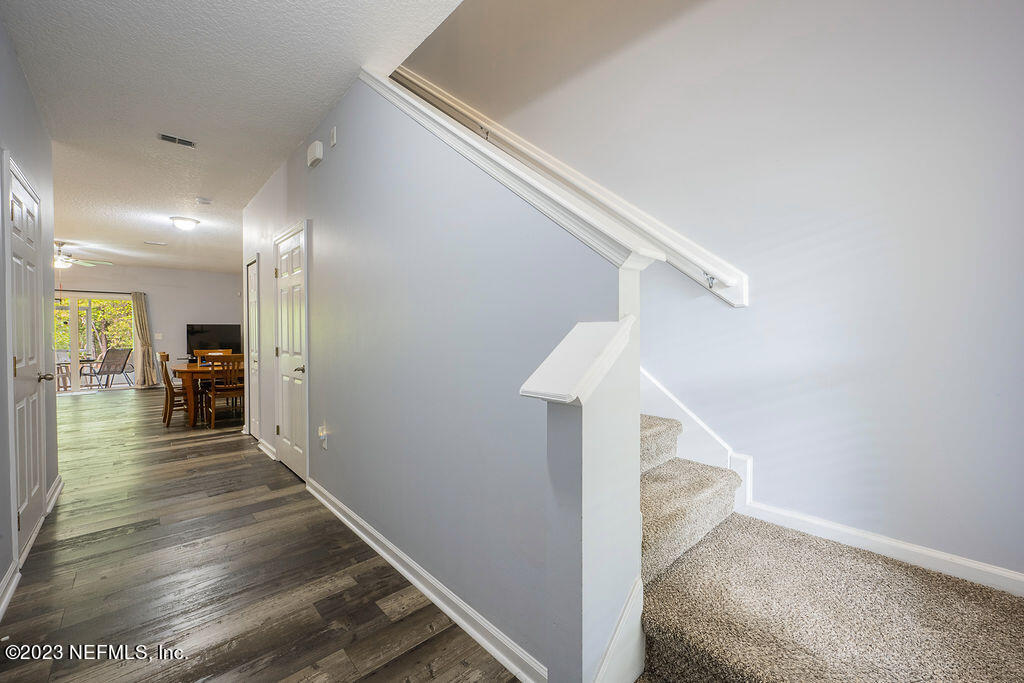 8683 Ribbon Falls Lane Jacksonville, FL 32244 - Photo 9 of 43 a view of entryway and hall with wooden floor