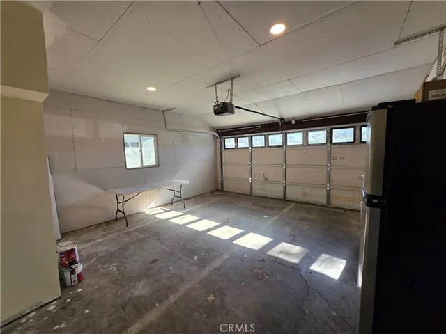 a view of a hallway with windows