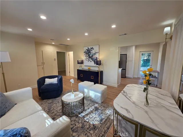 a living room with furniture and a table