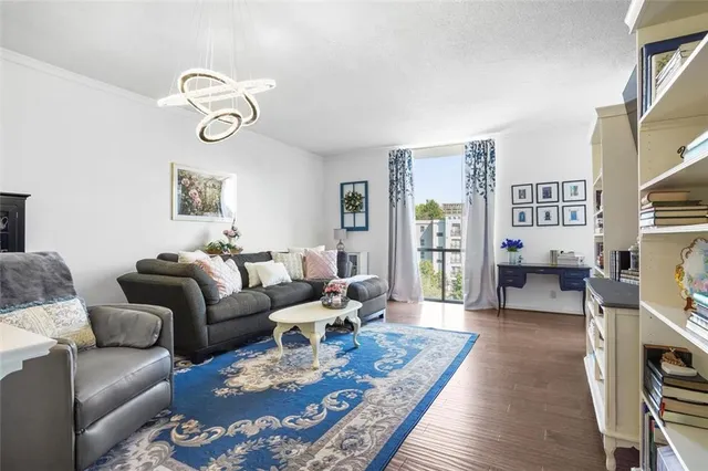 a living room with furniture wooden floor and a fireplace