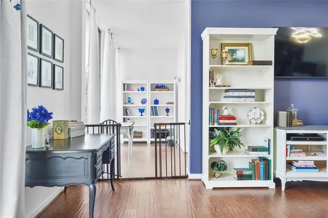 a dining room with furniture and wooden floor