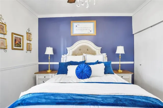 a view of a bedroom with furniture and window