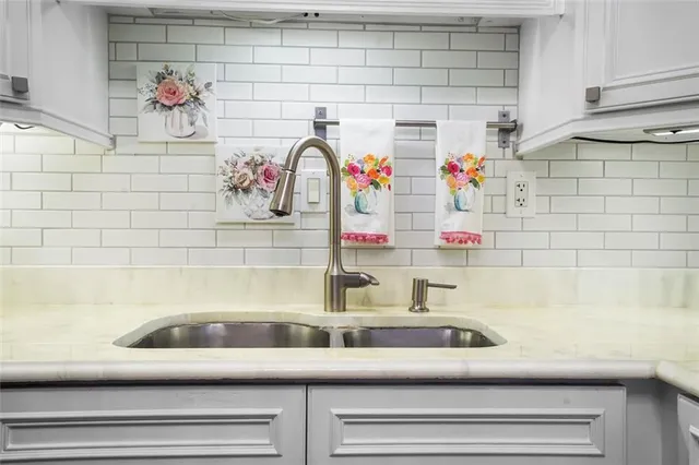 a bathroom with a sink and a shower