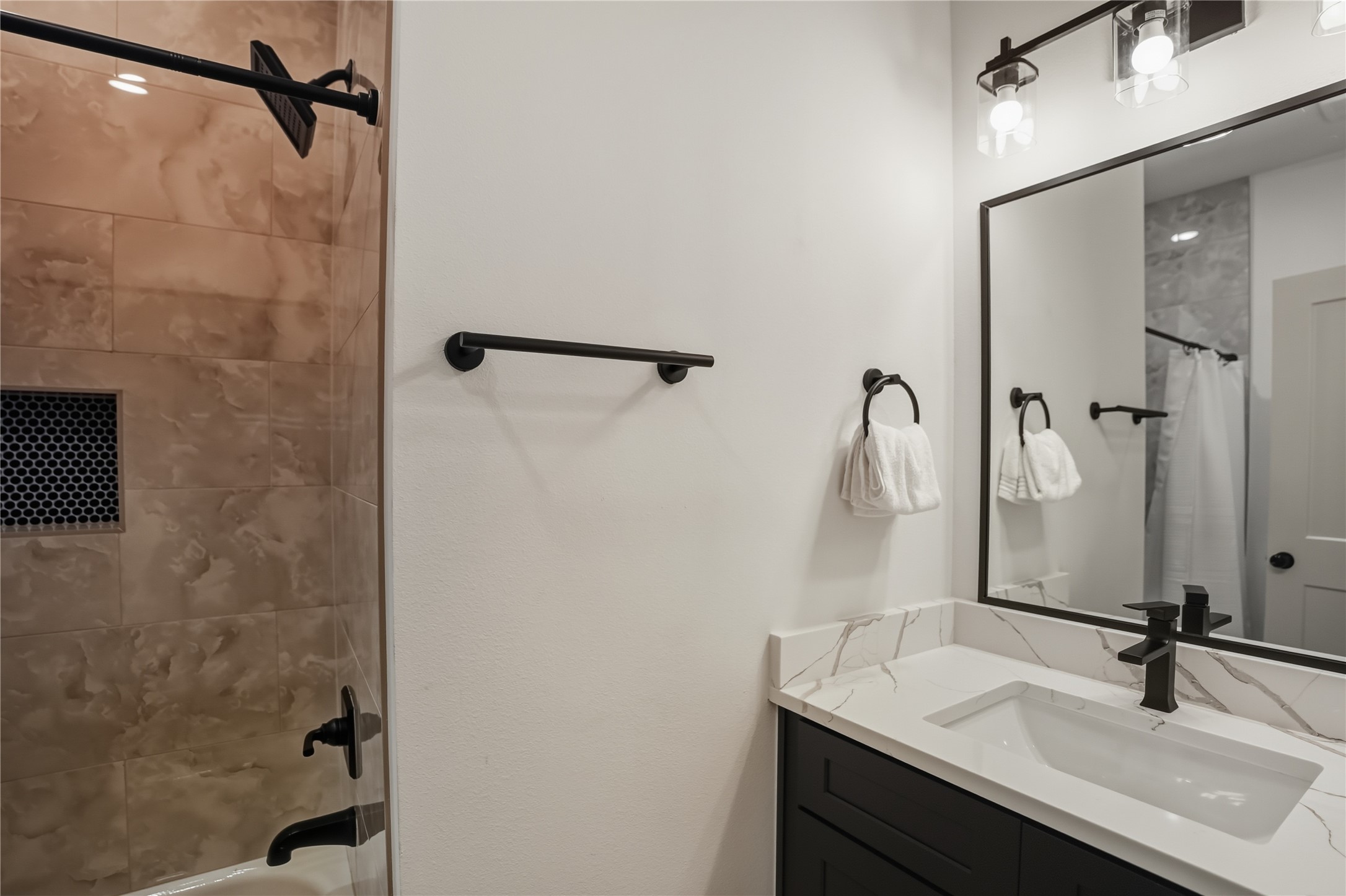 8017 Cora Street, Unit B Houston, TX 77088 - Photo 16 of 28 a bathroom with a sink and a mirror