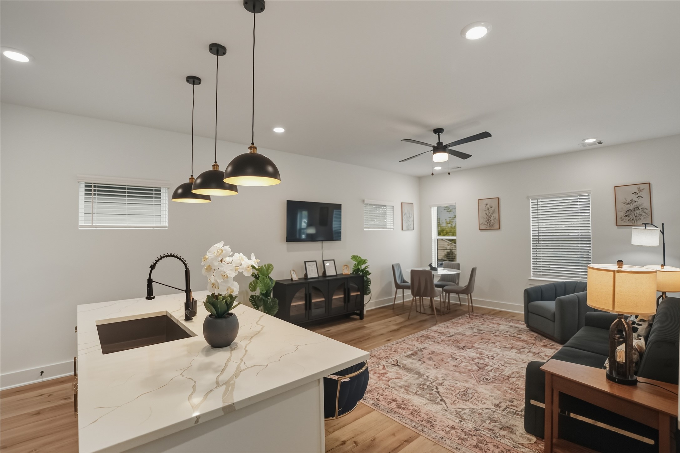 8017 Cora Street, Unit B Houston, TX 77088 - Photo 5 of 28 a kitchen with stainless steel appliances granite countertop a sink a stove and a wooden floors