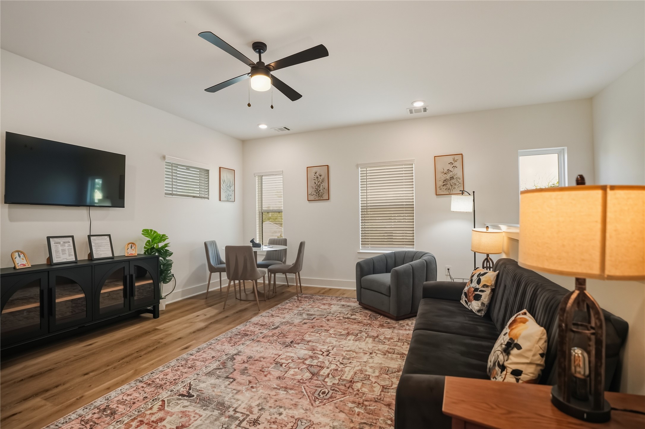 8017 Cora Street, Unit B Houston, TX 77088 - Photo 10 of 28 a living room with furniture and a flat screen tv