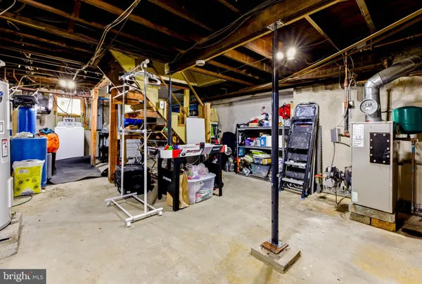 a view of a storage room with a refrigerator