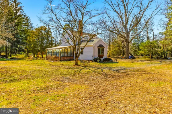 a view of a yard with swimming pool