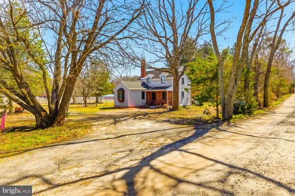 a house with trees in front of it