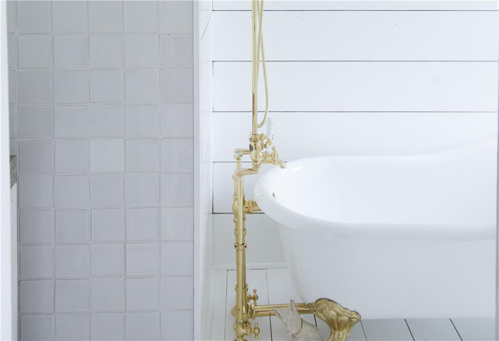 320 Johnston Road Upper St. Clair, PA 15241 - Photo 22 of 25 Full Bath. The bright white claw foot tub, white tile, and white wood really brighten the space.