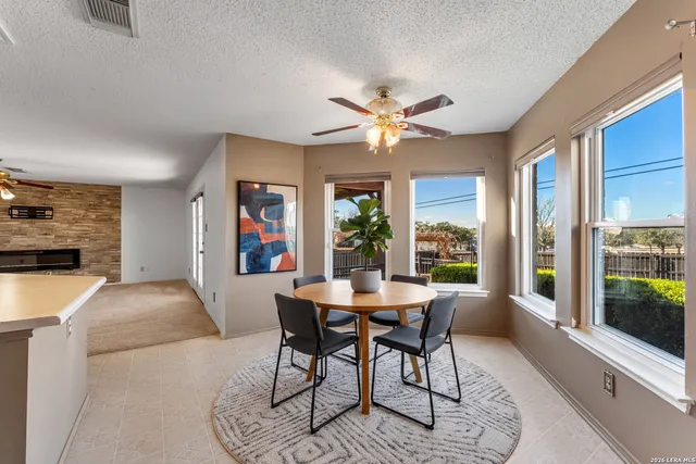 a view of a dining room with furniture window and outside view