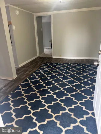 a bathroom with a black and white checkered floor