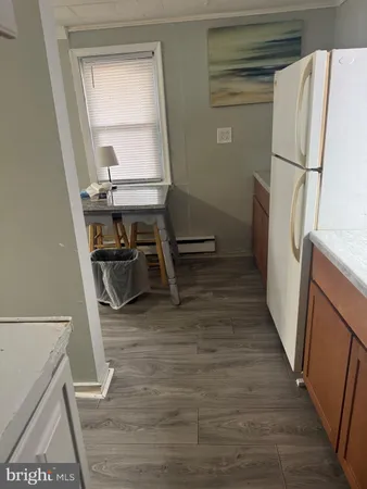 a kitchen that has a sink and a stove in it