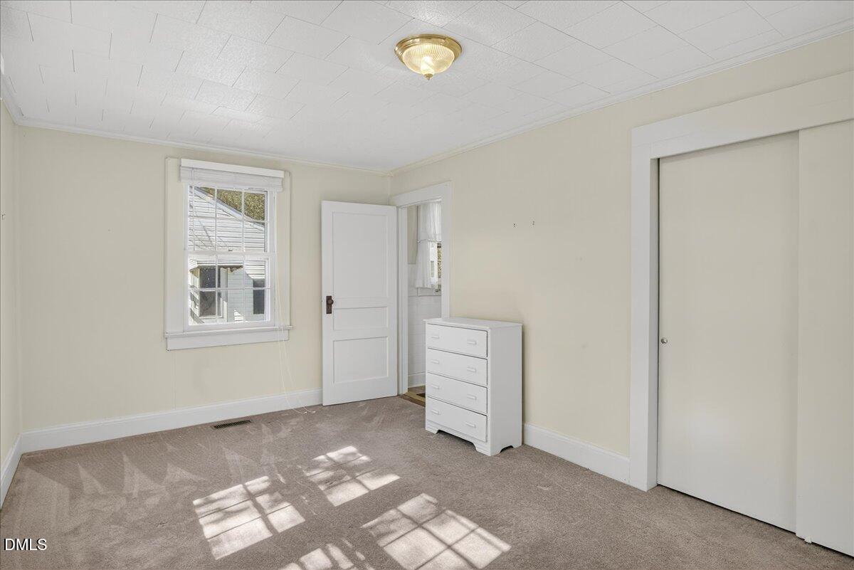 616 Roxboro Road Oxford, NC 27565 - Photo 16 of 38 a view of an empty room with a window