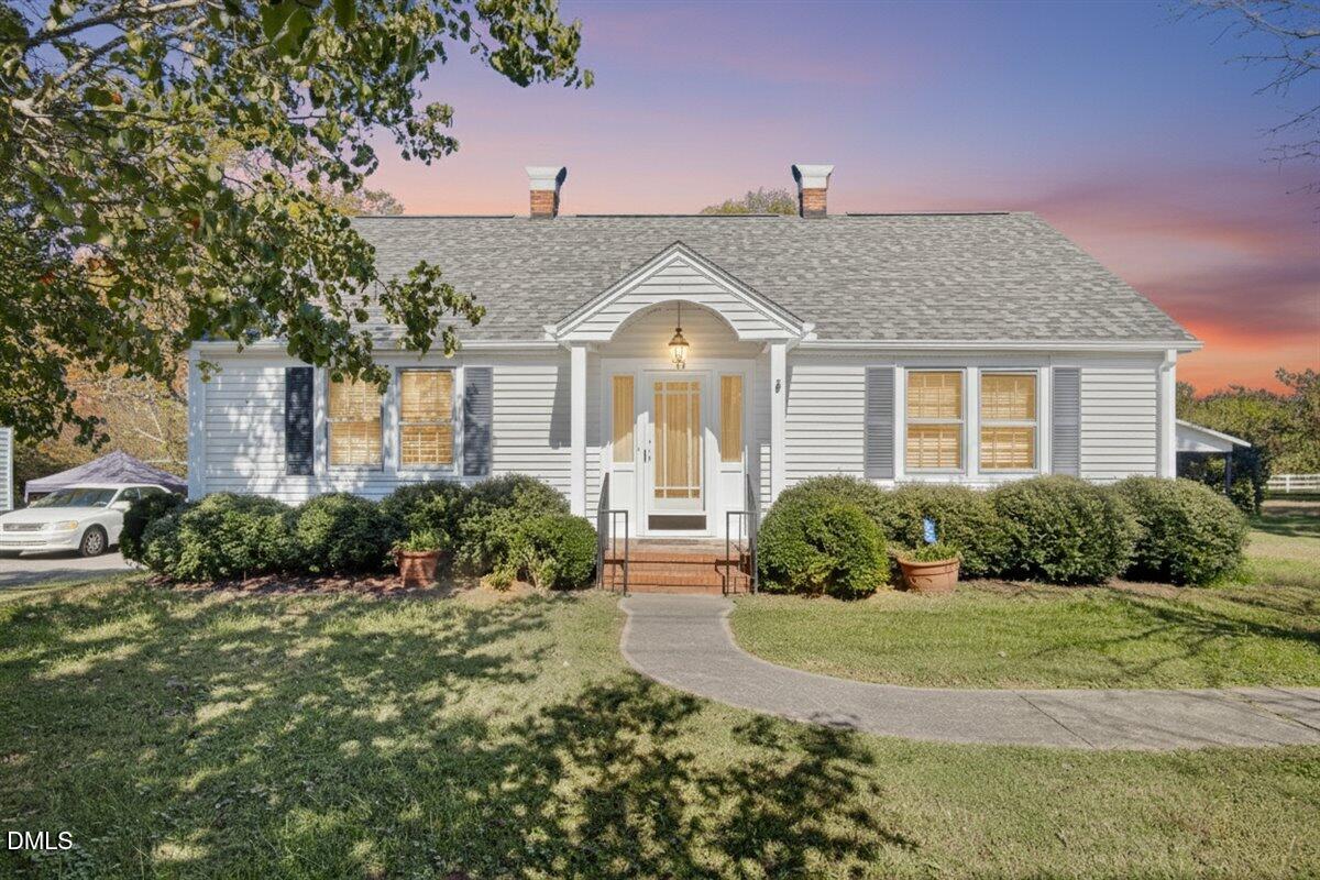 616 Roxboro Road Oxford, NC 27565 - Photo 2 of 38 a front view of a house with a yard