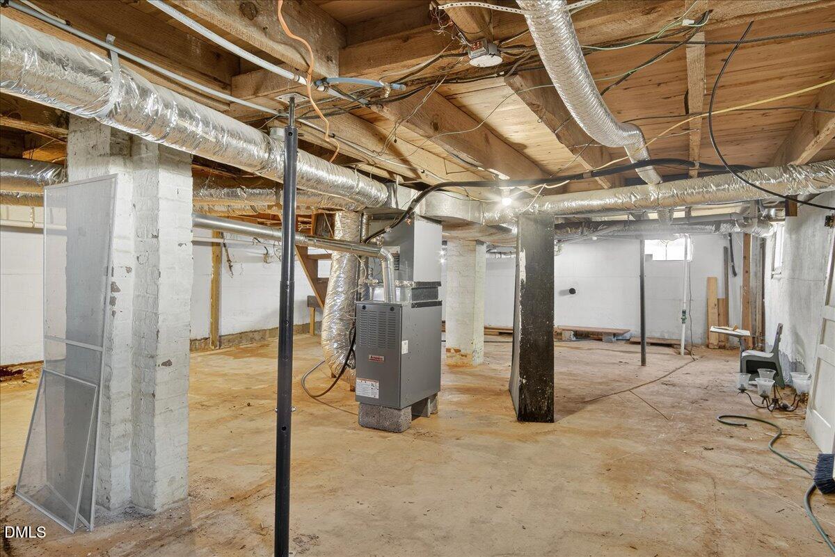616 Roxboro Road Oxford, NC 27565 - Photo 22 of 38 a view of a hallway with wooden walls