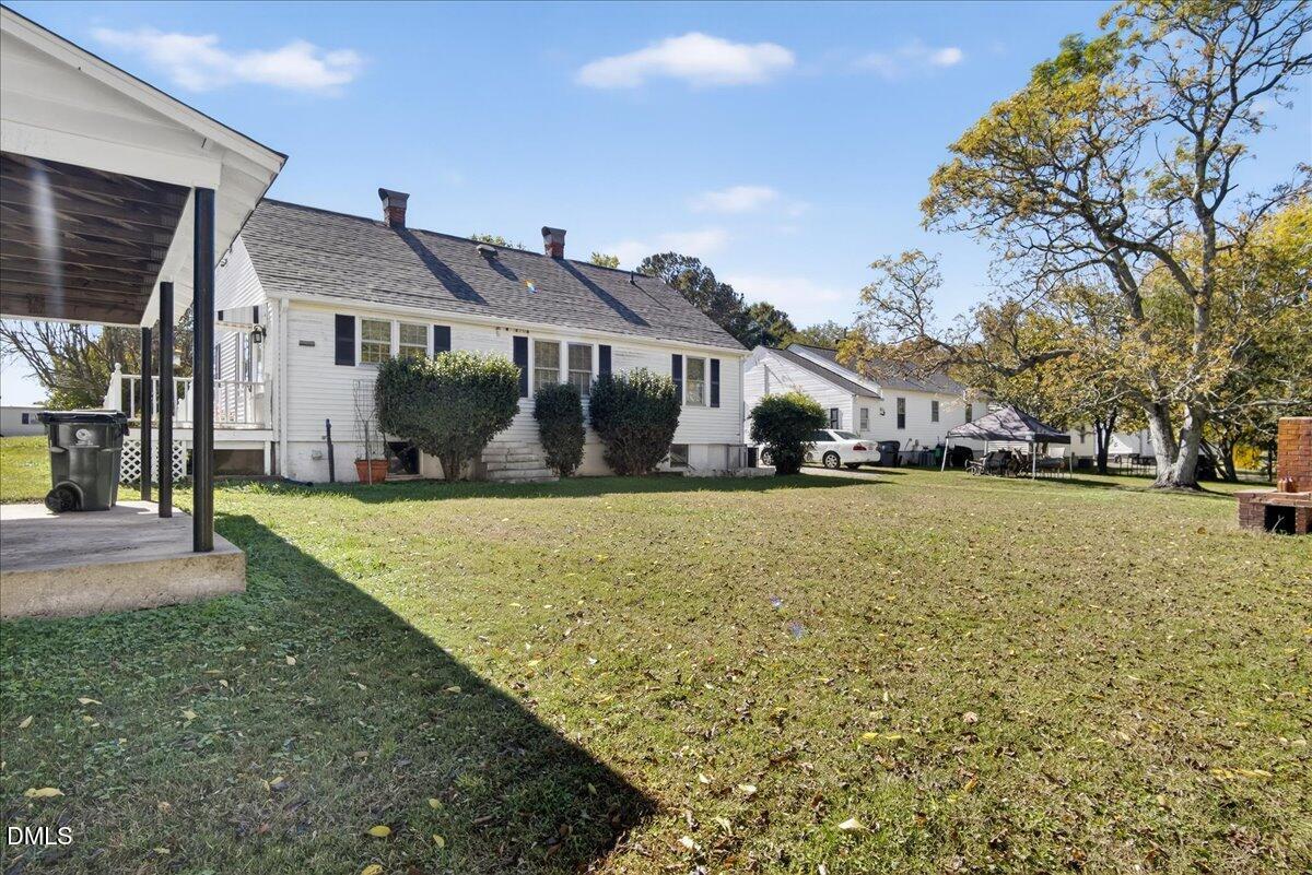 616 Roxboro Road Oxford, NC 27565 - Photo 24 of 38 a front view of a house with a yard and trees