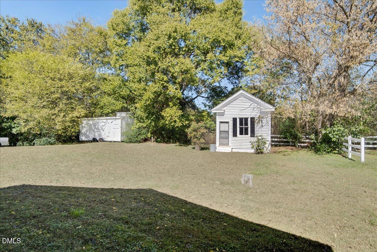 616 Roxboro Road Oxford, NC 27565 - Photo 25 of 38 a front view of a house with a yard and garage