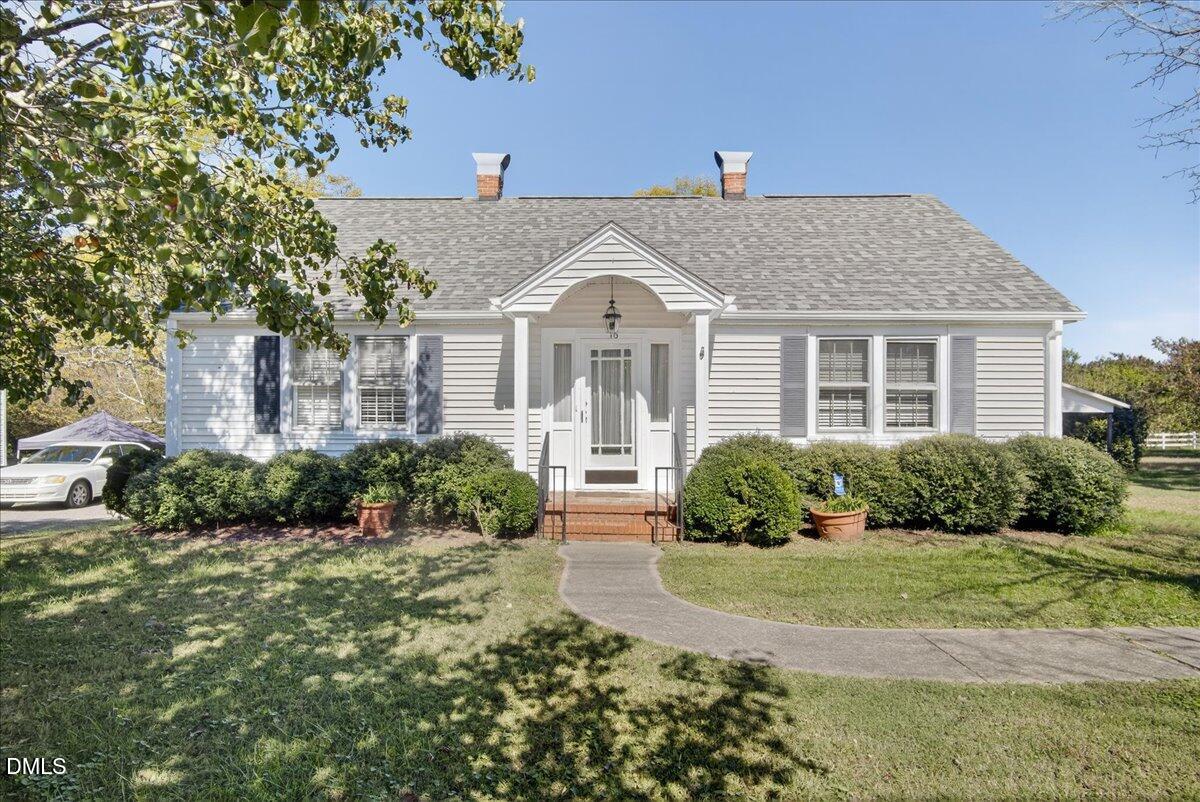 616 Roxboro Road Oxford, NC 27565 - Photo 27 of 38 a front view of a house with a yard