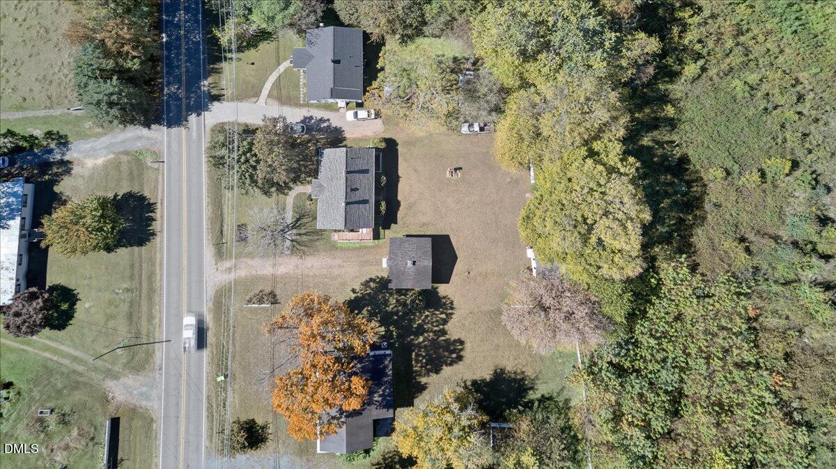 616 Roxboro Road Oxford, NC 27565 - Photo 33 of 38 an aerial view of a house with a yard