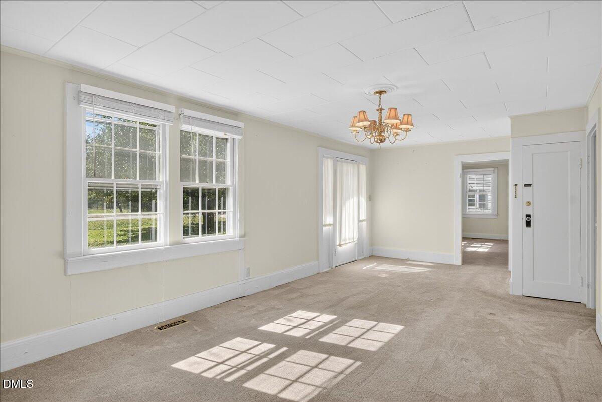 616 Roxboro Road Oxford, NC 27565 - Photo 5 of 38 an empty room with windows and closet