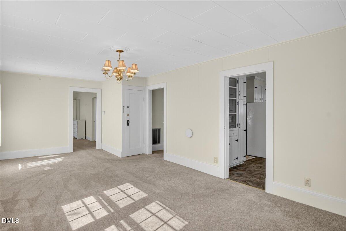 616 Roxboro Road Oxford, NC 27565 - Photo 6 of 38 a view of a chandelier in an empty room