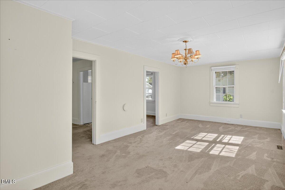 616 Roxboro Road Oxford, NC 27565 - Photo 8 of 38 an empty room with windows and closet