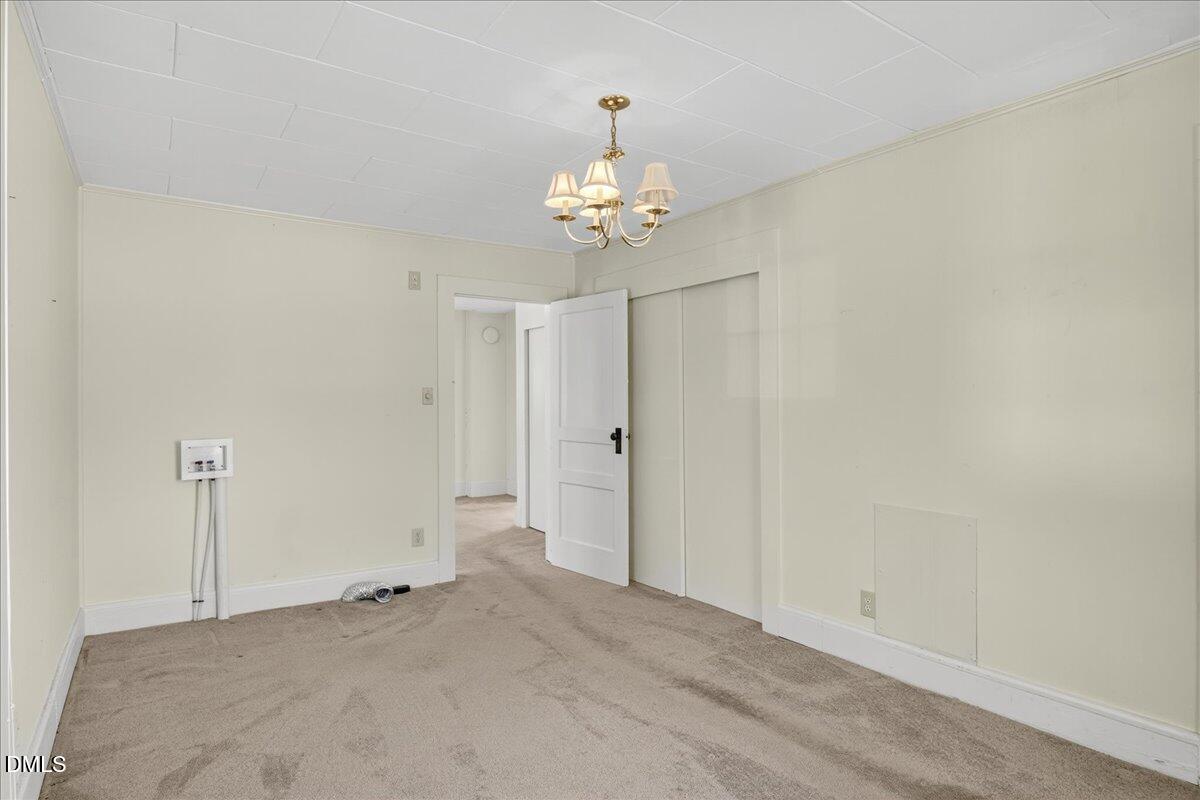 616 Roxboro Road Oxford, NC 27565 - Photo 10 of 38 a view of an empty room with chandelier fan