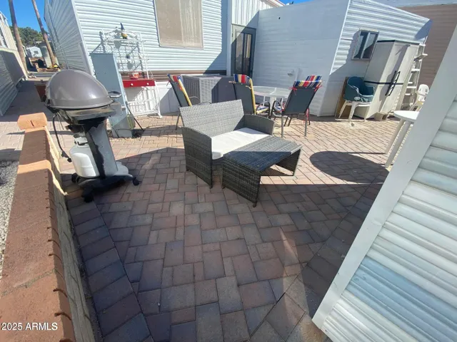 a view of a house with backyard and wooden floor