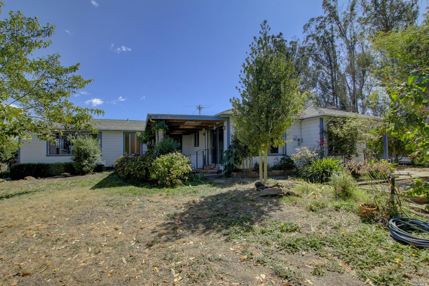 a front view of a house with garden