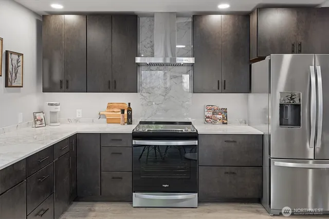 a bathroom with a toilet a sink a mirror and a bathtub