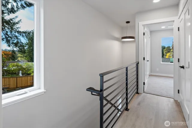 a view of a patio with table and chairs with wooden floor and fence