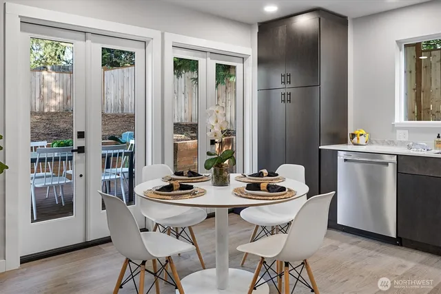 a kitchen with stainless steel appliances granite countertop a refrigerator and a sink